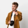 young-photographer-blonde-man-isolated-white-points-finger-you-with-confident-expression copy